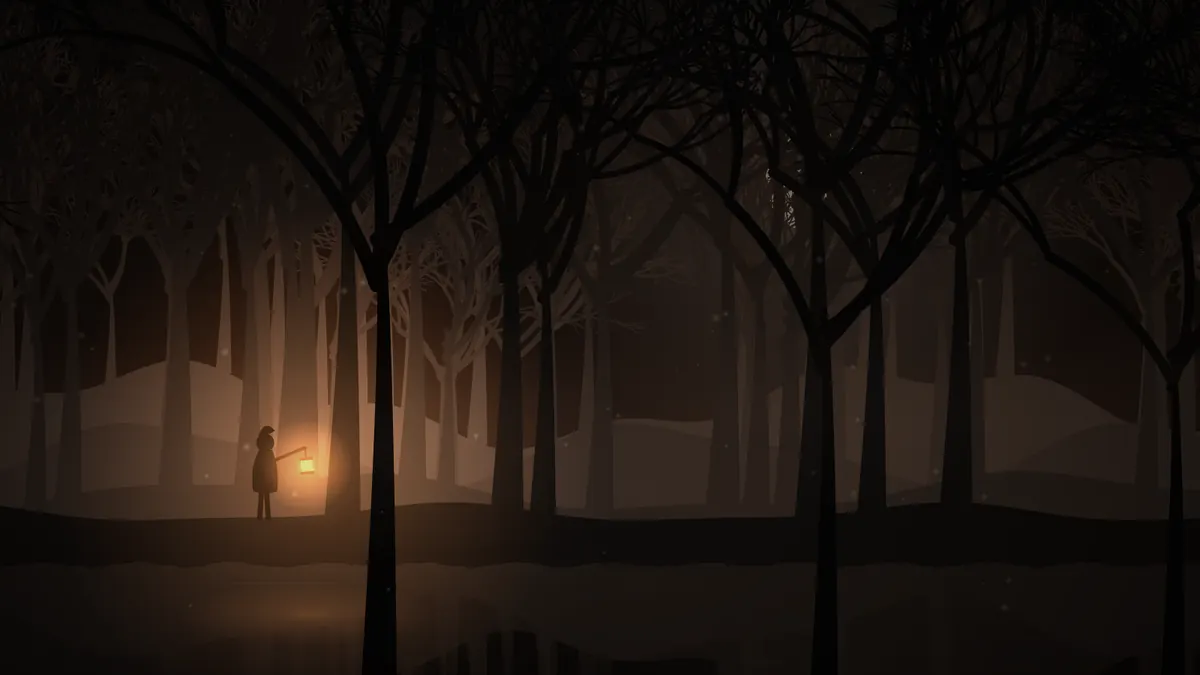 Bare black trees in an orange haze